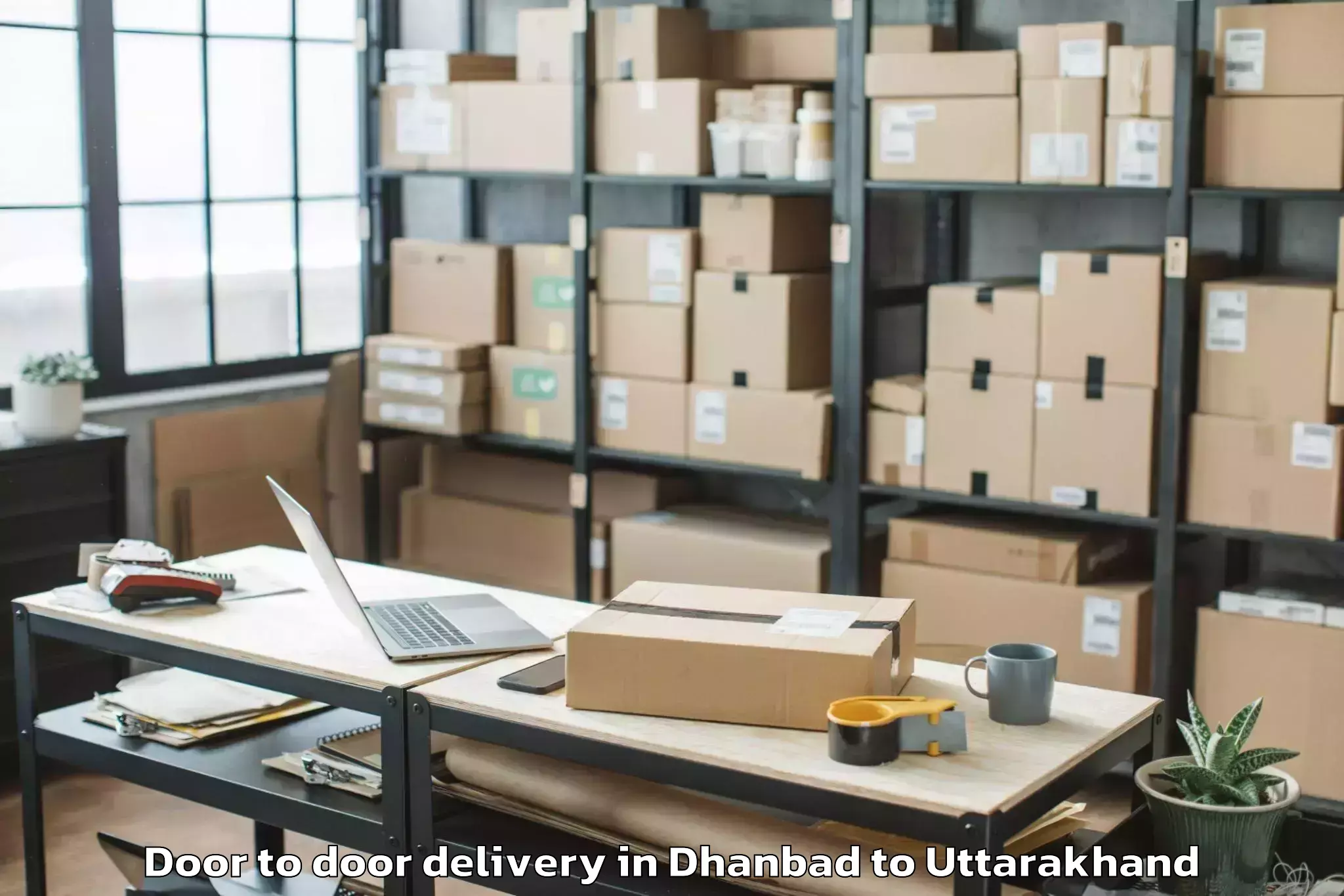 Easy Dhanbad to Banbasa Door To Door Delivery Booking